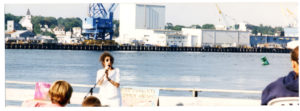 Liz addresses a crowd during her dance work Shipyard Project